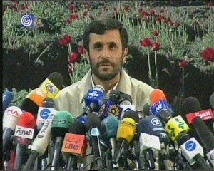 Iran\'s president, Mahmoud Ahmadinejad, in a press conference. as you can see, many people want to listen to him, otherwise, there\'s no explanation for all there mics.