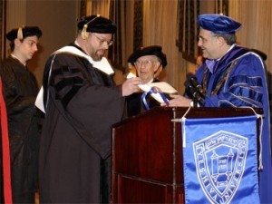 President Of Yeshiva University Joel presents an honorary degree to [left] Trustee J. Ezra Merkin as Ludwig Bravmann, vice chairman, Board of Trustees, looks on.