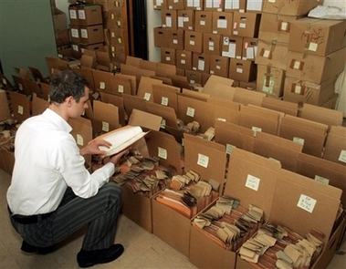 Head of Archives from the Holocaust Victims' Information and Support Center in Vienna Lothar Hoelbling looks through files, on Friday, June 1, 2007. [file photo]