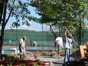 file photo volunteers  plant trees in Swan Lake