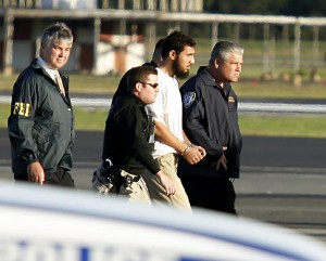 Suspected terrorist Najibullah Zazi is escorted onto a NYPD helicopter after his arrival at Teterboro airport.  Sep 25- Photo: NY Daily News
