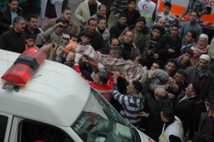 Palestinians carry the body of a man who was killed during an Israeli raid in the West Bank city of Nablus, on Dec. 26, 2009. 