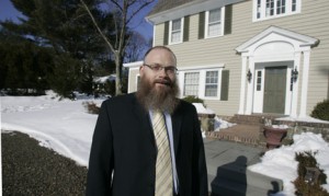 Rabbi Mendel Bogomilsky at his Short Hills home on Jefferson Avenue. Bogomilsky wants to fuse two adjoining lots, tear down existing structures and build a roughly 16,000-square-foot synagogue there. Photo Credit: Alexandra Pais/New Jersey Local News Service 