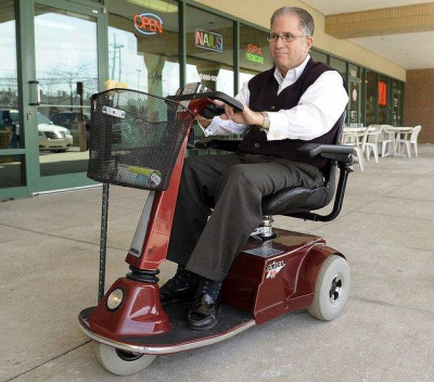 Michael Balkin, 59, of West Bloomfield says he's happy his scooter allows him to follow his Orthodox beliefs. (Clarence Tabb Jr. / The Detroit News)  