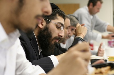 FILE - Rabbis and Jewish inmates eat a kosher lunch together at the yeshiva in prison program run by the aleph institute 