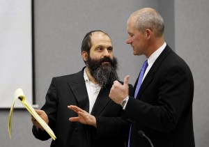 Sholom Rubashkin, left, talks with Defense Attorney F. Montgomery Brown during a break following open statements of the child labor changers trial at the Black Hawk County Courthouse on May, 10, 2010, in Waterloo, Iowa. (Rick Tibbott)
