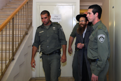 FILE - Rabbi Yitzhak Shapira, head of the "Od Yosef Chai Yeshiva" next to Yitzhar, arrives at the Jerusalem's Magistrate Court. Jan 27, 2010. Shapira is suspected of being involved in the torching of a mosque in neighboring Palestinian village, Yasuf. Photo by Kobi Gideon / FLASH90.