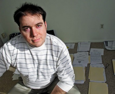Adrian Schoolcraft, suspended NYPD officer, in his apartment in Johnstown, NY - with copies police crime [incident] files and other materials he has assembled to support his "charges of corruption by police supervisors" in handling crime reports and investigations in the 81st precinct of the NYPD