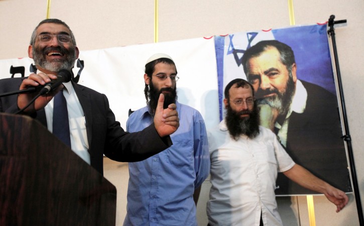 Knesset member Michael ben Ari (L) speaks during a ceremony honoring the late Jewish extremist leader Rabbi Meir Kahane, held in a Jerusalem hotel on 26 October 2010. At right is Baruch Marzel, an extreme right-wing Jew who intends to march tomorrow with supporters in an Israeli Arab town to continue marking the 20th anniversary of Rabbi Kahane's assassination in a hotel in Manhattan, NY.  EPA/YOSSI ZAMIR 