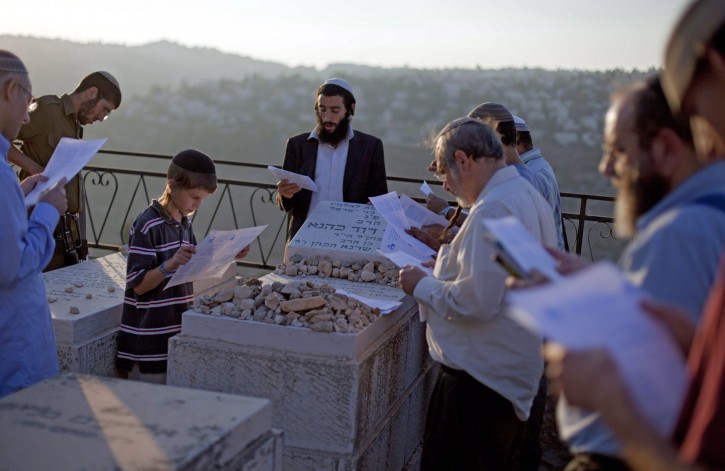 Followers of the late Rabbi Meir Kahane, founder of both the Jewish Defense League (JDL) and the 'Kach' party, pray at his grave in Jerusalem, on 26 October 2010, as they mark the 20th aniversary of his assassination in a hotel in Manhattan, NY. Israeli lawmakes outlawed and banned the Kach party claiming it was rascist, but his extreme right-wing movement still has many followers.  EPA/