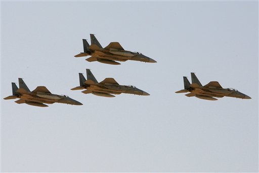 FILE - In this Sunday, Jan. 25, 2009 file photo, F-15 warplanes of the Saudi Air Force fly over the Saudi Arabian capital Riyadh during a graduation ceremony at King Faisal Air Force University. (AP Photo/Hassan Ammar, File)