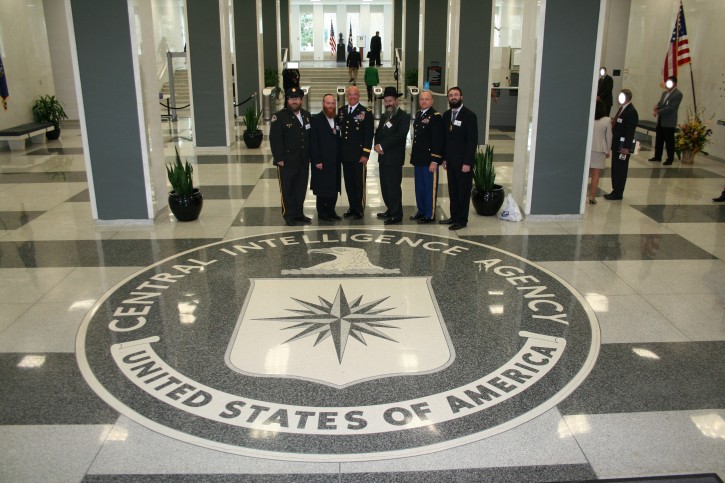Pictured standing at the CIA Seal in Headquarters are (Left to right), Rabbi Levi Stone-Chaplain of Connecticut Police, Rabbi Sol Lipschitz - Liaison-NYC Agencies, Major General Karl R. Horst, U.S. Army, Rabbi Yosef Carlebach - Chaplain of New Jersey State Police, Chaplain Colonel Steven L. Berry-- U.S. Army, and Rabbi Mendy Carlebach, Chaplain-Port Authority of NY & NJ Police.