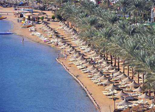 A general view showing a partially empty beach at the Red Sea resort of Sharm el Sheik, Egypt, Thursday, Dec. 2, 2010. An oceanic white tip shark badly mauled four Russian tourists swimming close to their beach hotels in two separate attacks at an Egyptian Red Sea resort, a local conservation official said. (AP Photo/Hussien Talal)
