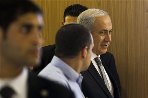 Israel's Prime Minister Benjamin Netanyahu, right, leaves a faction meeting in the Knesset, Israel's parliament, in Jerusalem, Monday, Feb. 28, 2011. Israel's defense minister said Monday that his country would be ready to talk peace with Syria if Damascus were serious about doing so, a sharp departure from Prime Minister Benjamin Netanyahu's go-slow approach to peacemaking while the Middle East is in turmoil. (AP Photos/Bernat Armangue)