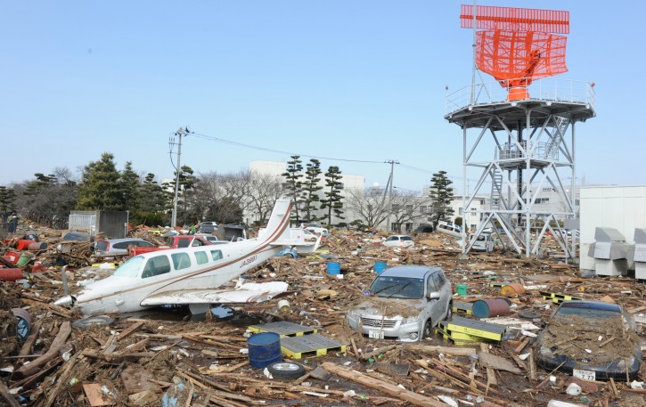 A light aircraft is seen in the rubble at Sendai airport after a devastating earthquake and tsunami that ravaged much of Japan's Pacific East coast on 11 March 2011, Natori, Miyagi Prefecture, Japan, March 13 2011. Japanese police say that the number of people killed in the disaster could surpass 10,000.  EPA/ALEX HOFFORD