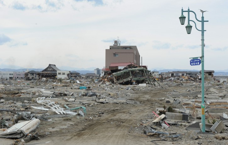 A street light is seen still standing among the rubbles of the earthquake and tsunami ravaged town of Natori, Migagi Prefecture, Japan, 14 March 2011. Tens of thousands of people were feared dead after last week's earthquake and tsunami in north-eastern Japan as Prime Minister Naoto Kan said 15,000 people had been rescued so far.  EPA/ALEX HOFFORD