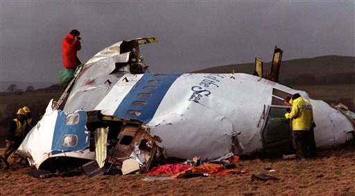 FILE -  In this Dec 22, 1988 file photo  Police and investigators look at what remains of the flight deck of Pan Am 103 on a field in Lockerbie, Scotland.  Swedish tabloid Expressen said Wednesday Feb. 23, 2011 that Libya's recently resigned justice minister claims Moammar Gadhafi personally ordered the Lockerbie bombing that killed 270 people in 1988.  Expressen quotes Mustafa Abdel-Jalil as telling their correspondent in Libya that "I have proof that Gadhafi gave the order about Lockerbie." The comments were translated from Arabic to Swedish. (AP Photo/File)