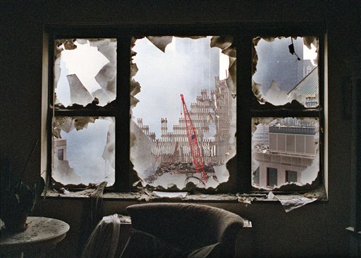 FILE - In this  Sept. 20, 2001 file photo, ground zero is seen through a shattered window of an 18th floor apartment overlooking the World Trade Center site.  AP