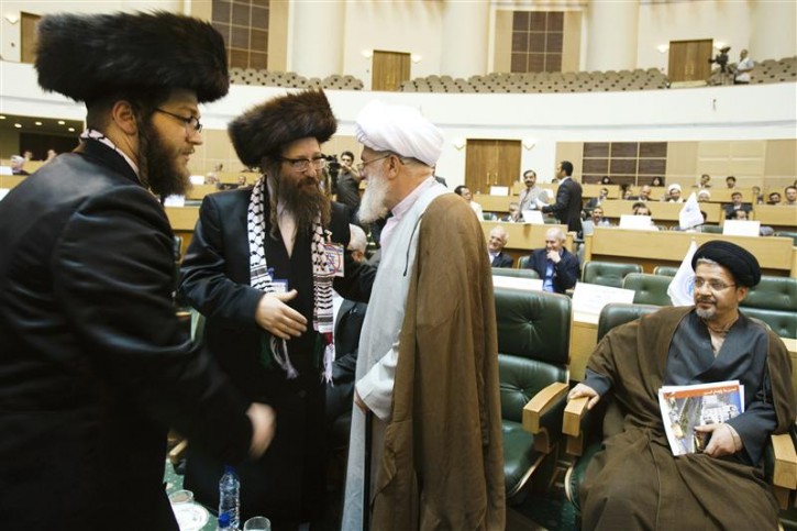 U.S. Rabbi Yisroel Dovid Weiss, of the organisation Jews United Against Zionism (2nd L) speaks with a cleric as Canadian Rabbi Yeshaye Rosenberg (L) looks on, during an International conference on Global Alliance against Terrorism for a Just Peace, in Tehran May 14, 2011. REUTERS/Raheb Homavandi