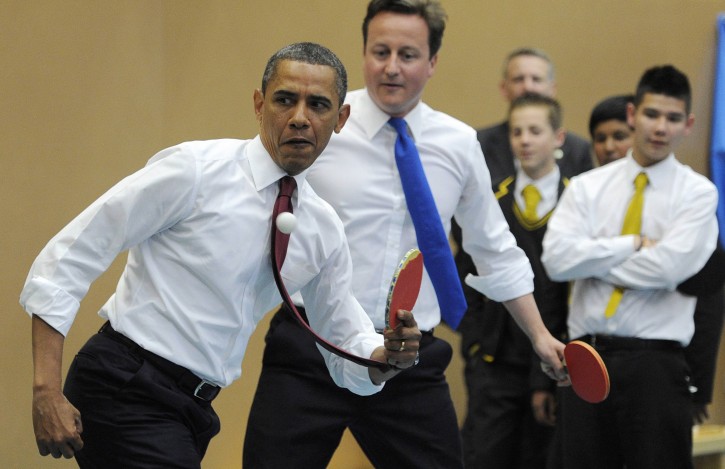 U.S. President Barack Obama, left,  and Britain's Prime Minister David Cameron play table tennis at Globe Academy, in south London  Tuesday May 24, 2011. (AP Photo/Paul Hackett, Pool)