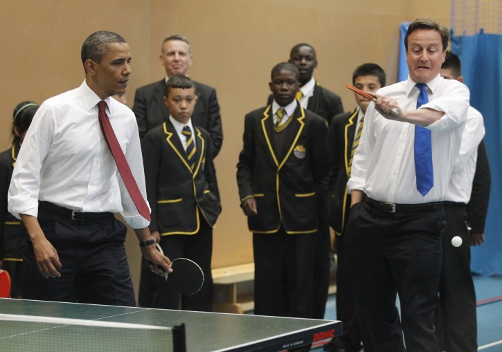 President Barack Obama and British Prime Minister David Cameron play table tennis with students during a visit to the Globe Academy in London, Tuesday, May 24, 2011. (AP Photo/Charles Dharapak)