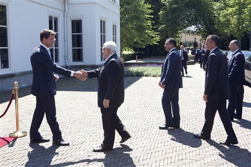 Netherlands' Prime Minister Mark Rutte, left, welcomes Palestinian President Mahmoud Abbas, second left, outside his Catshuis residence in The Hague, Netherlands, Thursday, June 30, 2011. Mahmoud Abbas is on a three-day working visit to the Netherlands. (AP Photo/Rob Keeris, Pool)