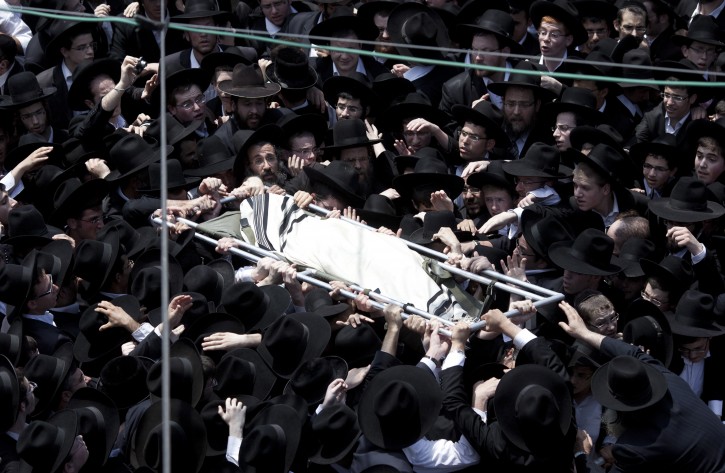 Ultra Orthodox Jews carry the body of Rabbi Michel Yehuda Lefkowitz during his funeral in Bnei Brak, outside Tel Aviv, on 28 June 2011. Rabbi Lefkowitz was considered one of the greatest sages of his generation by the Lithuanian hareidi-religious stream. Lefkowitz died in the age of 97, his funeral was attended by more than 100,000 people.  EPA/OLIVER WEIKEN