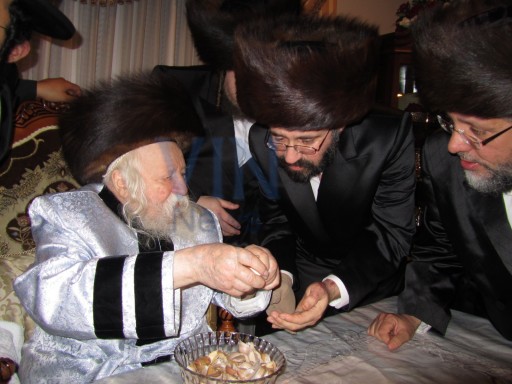 In this July 16 2011 photo provided to VIN News, Aron Rottenberg is seen at the Melava Malka of Zlochiv Netanya rebbe in Monsey, NY, on the far right is seen Moshe Berkowitz from Monsey Former gabbi of Ribnitzer zt"l.