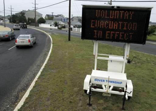 A sign warns of the voluntary evacuation that was set by New Jersey Gov. Chris Christie as the New Jersey Shore braces itself for Hurricane Irene, Thursday, Aug. 25, 2011, Ortley Beach, N.J. (AP Photo/Julio Cortez)