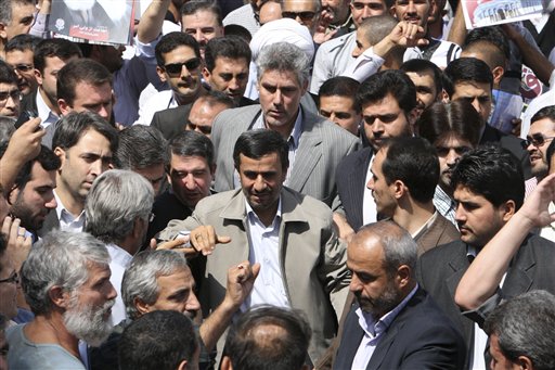 Escorted by his bodyguards, Iranian President Mahmoud Ahmadinejad, center, attends an annual nation-wide pro-Palestinian rally known as Quds Day, in Tehran, Iran, Friday, Aug. 26, 2011. Ahmadinejad said on Friday there will be no room for Israel in the region after the formation of a Palestinian state, and that once the state is established, the liberation of all Palestinian lands should follow. Quds is the Arabic word for Jerusalem. (AP Photo/Vahid Salemi)