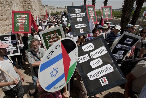 Israeli and Palestinians take part in a rally to voice support for U.N. recognition of a Palestinian state, in Jerusalem, Friday, July 15, 2011.  AP