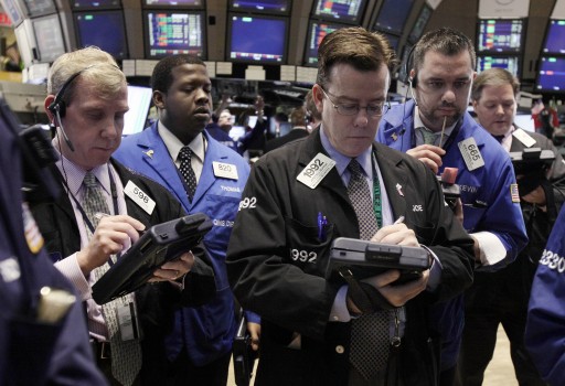 Traders work on the floor of the New York Stock Exchange Monday, Nov. 28, 2011. Hopes for a more far-reaching solution to Europe's debt crisis and a strong start to the U.S. shopping season sent stocks sharply higher Monday. (AP Photo/Richard Drew)