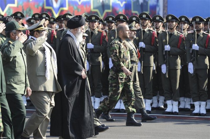 Iran's Supreme Leader Ayatollah Ali Khamenei (L centre) reviews an honor guard during the Iranian army land force academy graduating ceremony in Tehran November 10, 2011. Iran's Supreme Leader warned the United States and Israel on Thursday not to launch any military action against its nuclear sites, saying it would be met with "iron fists," state television reported. REUTERS/Leader.ir/Handout