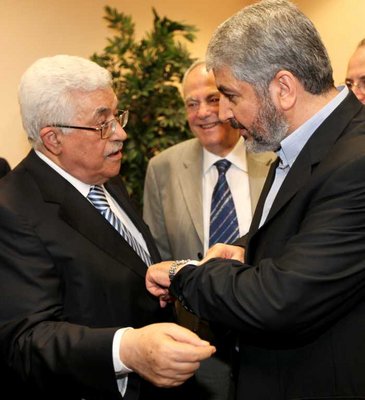 FILE - Handout picture released by the Hamas Press Office shows Palestinian president Mahmud Abbas (L) speaking with Hamas leader Khaled Meshaal (R) in Cairo, Egypt, 04 May 2011
