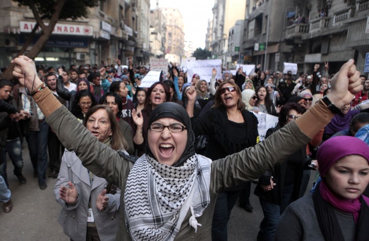 Hundreds of Egyptian women march at Cairo streets during a protest as they angered by the recent violence used against them in clashes between police and protesters in Cairo, Egypt Tuesday, Dec. 20, 2011. Egypt's ruling generals are coming under mounting criticism at home and abroad for the military's use of excessive force against unarmed protesters, including women, as they try to crush the pro-democracy movement calling for their ouster. (AP Photo/Amr Nabil)