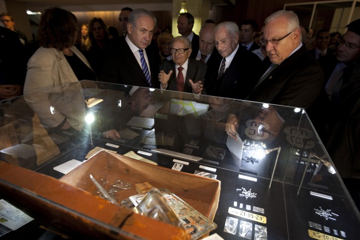 Former Israeli intelligence and security chief involved in the capture of Nazi SS officer Adolf Eichmann, Rafael "Rafi" Eitan, center, gestures as he speaks with Israeli Prime Minister Benjamin Netanyahu, center left, Gabriel Bach, center right, one of the prosecutors during Eichmann's trial, and Knesset speaker Reuven Rivlin, during an opening of an exhibition about Eichmann's capture, in the Knesset, Israel's parliament, in Jerusalem, Monday, Dec. 12, 2011. Fifty years Eichmann was convicted in an epic trial that helped shape Israel's national psyche, the Israeli parliament on Monday displayed dozens of never-seen-before artifacts from the daring 1960 operation in Argentina that captured the Nazi criminal. (AP Photo/Sebastian Scheiner)