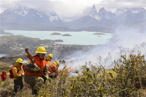 Firefighters work in an area of the Torres del Paine national park in Torres del Paine, Chile, Sunday Jan. 1, 2012. Firefighters are making progress against a major blaze that has burned at least 48 square miles (12,500 hectares) in one of Chile's most spectacular national parks. The Israeli tourist accused of setting the fire denied guilt. (AP Photo)