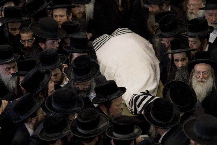 Ultra Orthodox carry the body of Rabbi Moshe Yehoshua Hager, leader of the Hassidic sect Vizhnitz in Israel, from the Vizhnitz Synagogue during his funeral procession in Bnei Brak , Ultra Orthodox Jewish town near Tel Aviv, Israel, Wednesday, March 14, 2012. Rabbi Moshe Yehoshua Hager was 95. (AP Photo/Ariel Schalit)