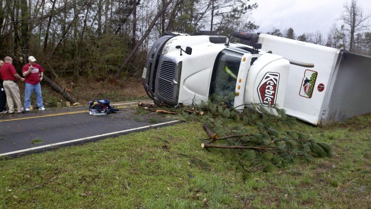 A semitrailer lies flipped near Sparkman High School on Jeff Road after a reported tornado came through Harvest, Ala., Friday, March 2, 2012. (AP Photo/The Huntsville Times, Eric Schultz)