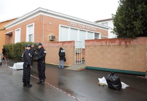 A Police officer are seen outside the Ozar Hatorah Jewish school, in Toulouse, France, 19 March 2012, where a man opened fire in front of the school and killed a 30-years old teacher and three children aged 6, 3 and 10. Two others were wounded  EPA/CAROLINE BLUMBERG 