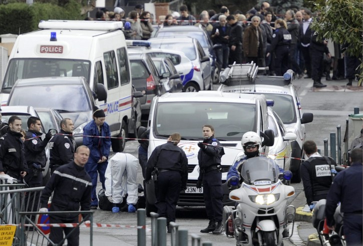 Forensic and Police officers are seen at work in front of the Ozar Hatorah jewish school in Toulouse, France, 19 March 2012, where a man opened fire and killed a 30-years old teacher and three children aged 6, 3 and 10. Two others were wounded.  EPA/MAXPPP/XAVIER