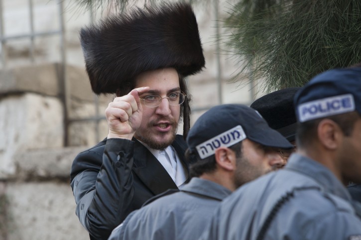 Ultra Orthodox Jewish men residents from Meah Shearim neighborhood in Jerusalem clashes with Israeli police in Hanivim street in Jerusalem. June 16, 2012. Photo by Yonatan Sindel/Flash 90 