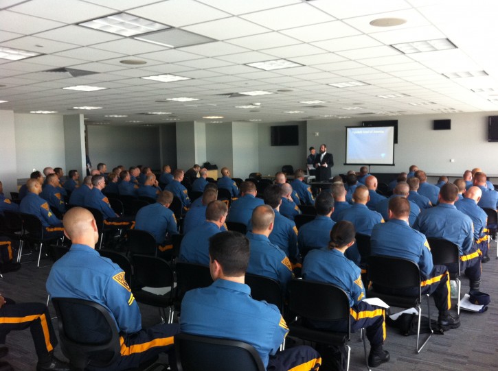 In this June 2012 photo, NJ State Troopers being briefed by community leaders on the upcoming Siyum HaShas 
