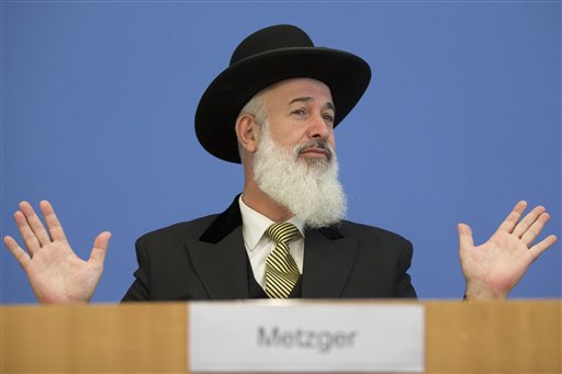 Ashkenazi Chief Rabbi of Israel Yona Metzger briefs the media at the Federal Press Conference organization in Berlin, Tuesday, Aug. 21, 2012. Israel's chief rabbi is in Germany for talks aimed at smoothing over controversy over the legality of circumcising young boys. German lawmakers have called for the government to draft a law this fall explicitly permitting 'medically correct circumcision'. That call came after a Cologne court concluded in June that circumcision amounts to bodily harm. (AP Photo/Markus Schreiber)