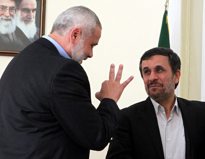 FILE - Iranian president Mahmoud Ahmadinejad (R) talks to the prime minister of the Gaza strip and leading member of the Hamas movement, Ismail Haniyeh at the presidential office in Tehran, Iran, 12 February 2012. EPA