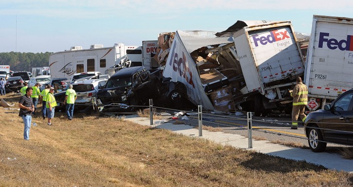 Cars and Trucks are piled on Interstate 10 in Southeast Texas Thursday Nov. 22, 2012. (AP Photo/The Beaumont Enterprise, Guiseppe Barranco) 