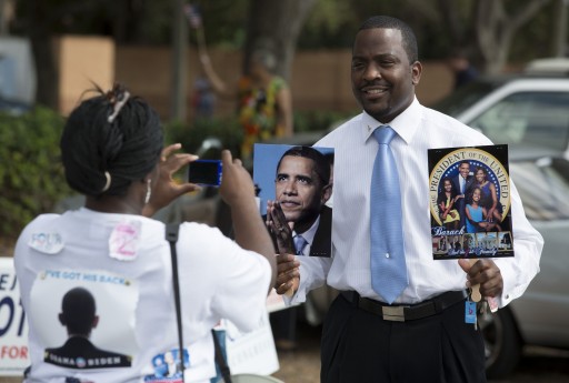Supporters of President Barack Obama gather outside a polling station during the U.S. presidential election in Tampa, Florida November 6, 2012. REUTERS/Scott Audette 