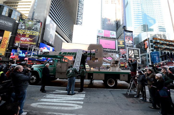  Workers move giant, seven-foot-tall '13' at the Times Square Museum and Visitor Center, in New York, New York, USA, 19 December 2012. The numeral will be installed atop One Times Square to complete the '2-0-1-3' sign that lights up at midnight to announce the beginning of the New Year at the completion of the Ball Drop.  EPA/ANDREW GOMBERT
