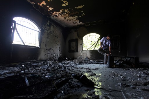 A Libyan man investigates the inside of the U.S. Consulate after an attack that killed four Americans, including Ambassador Chris Stevens, on the night of Tuesday, Sept. 11, 2012, in Benghazi, Libya. (AP Photo/Mohammad Hannon, File)