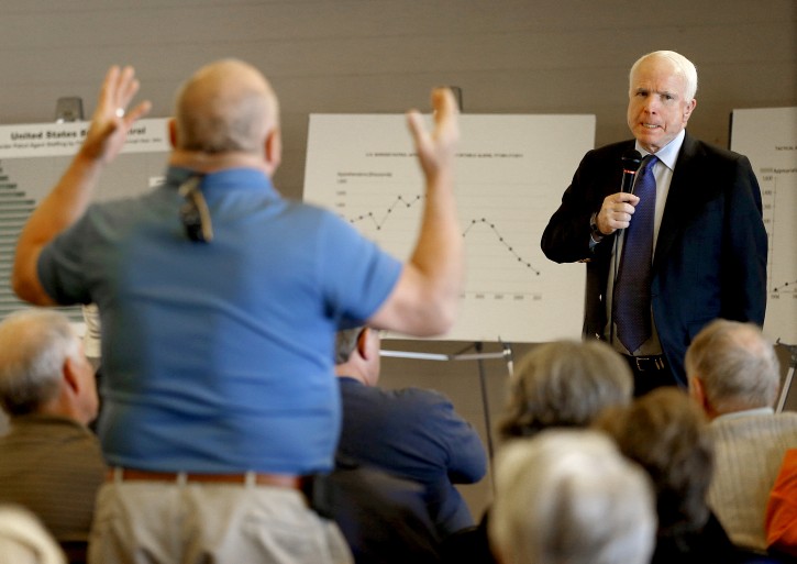 U.S. Sen. John McCain, R-Ariz., defended his proposed immigration overhaul , Tuesday, Feb. 19, 2013, to an angry crowd in suburban Arizona in the latest sign that this border state will play a prominent role in the national immigration reform debate. (AP Photo/Matt York)
